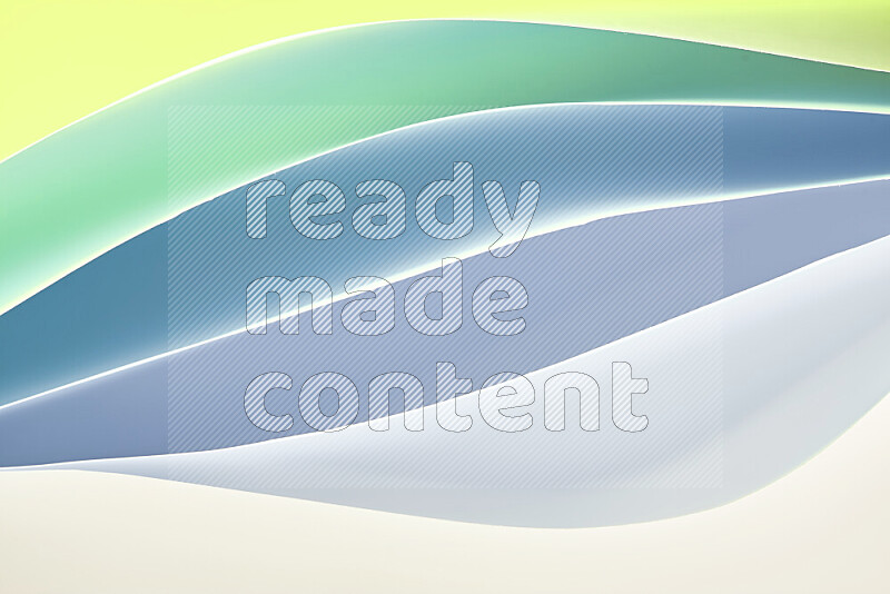 This image showcases an abstract paper art composition with paper curves in green and yellow gradients created by colored light