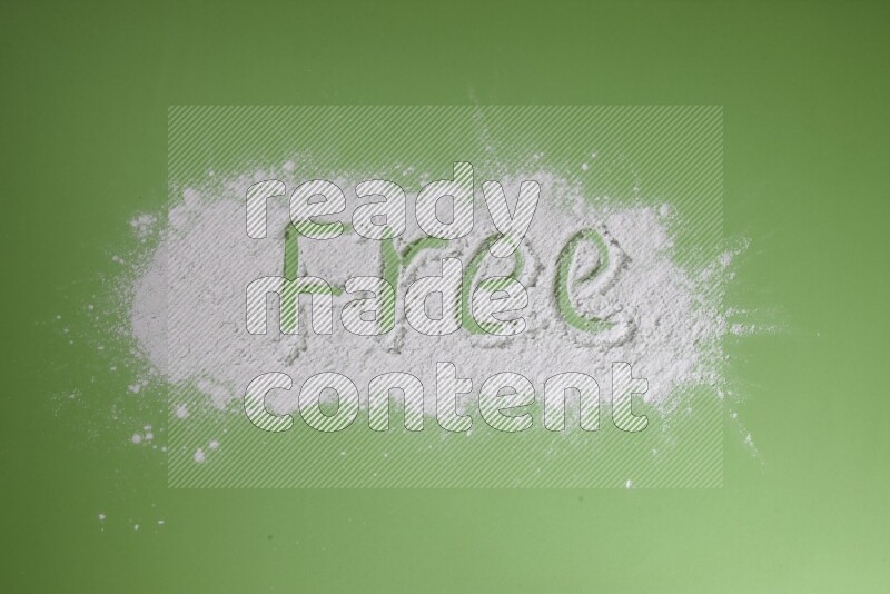 A word written with powder on green background
