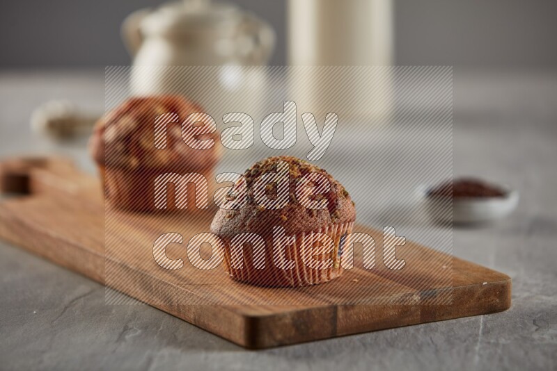 Pistachio cupcake on a wooden board