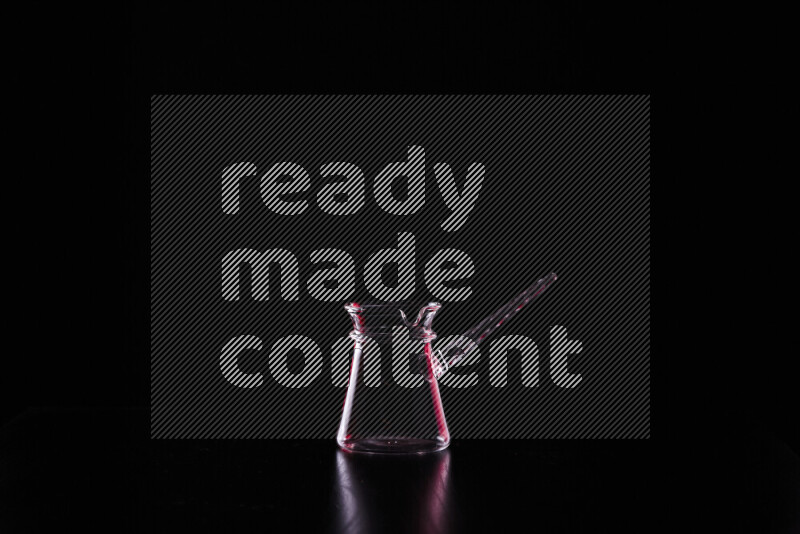 Glassware with rim light in red and white against black background