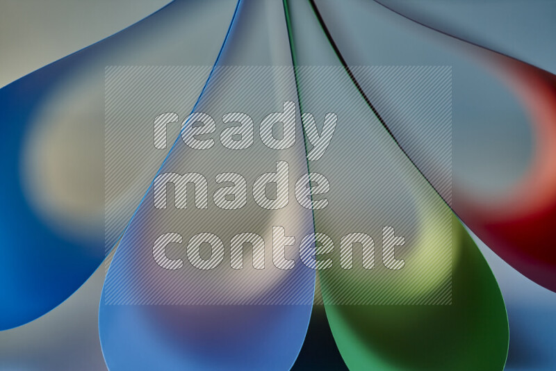 An abstract art piece displaying smooth curves in colorful gradients created by colored light