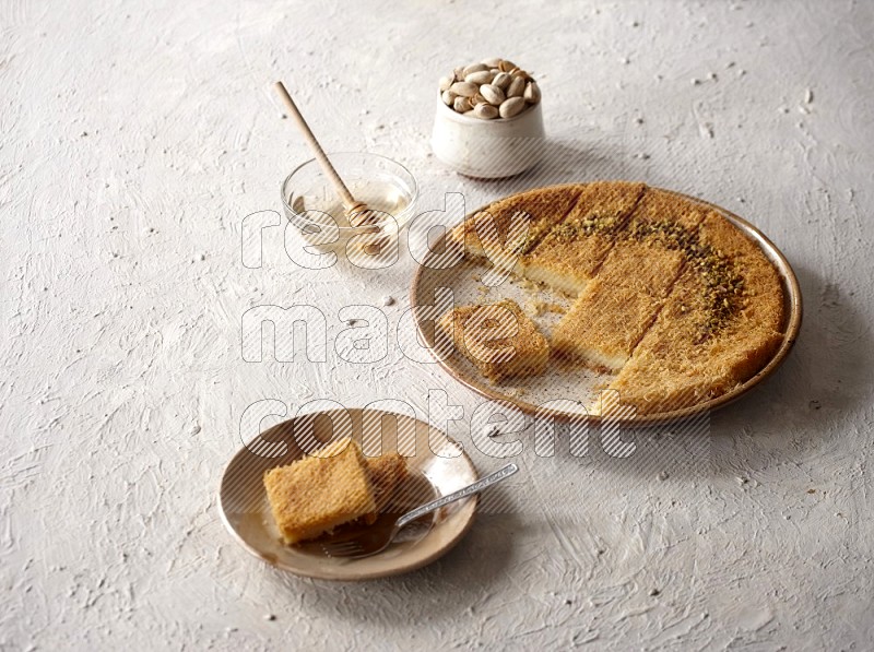 Konafa with nuts and honey in a light setup