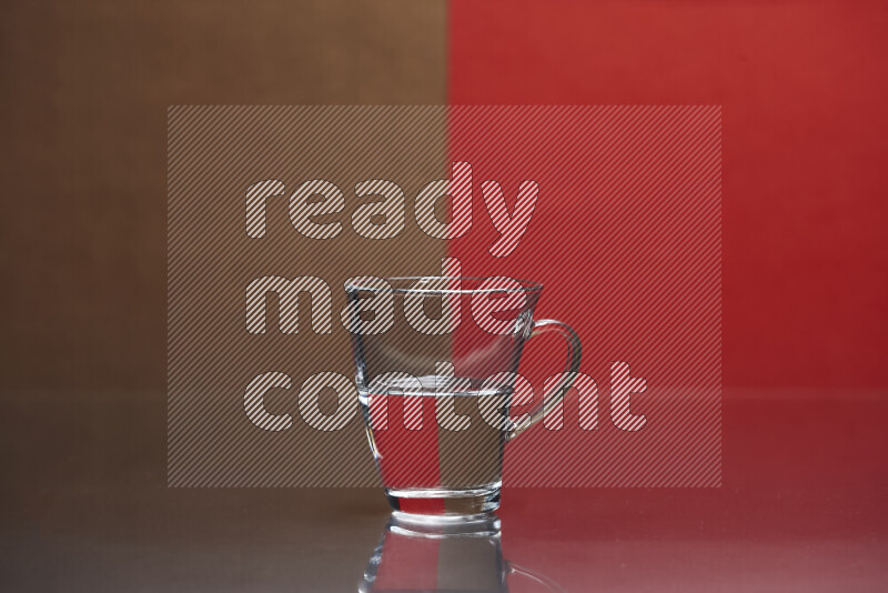 The image features a clear glassware filled with water, set against brown and red background