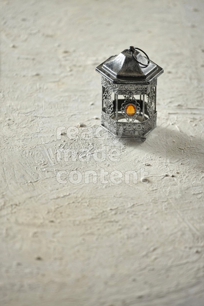 A lantern on textured white background