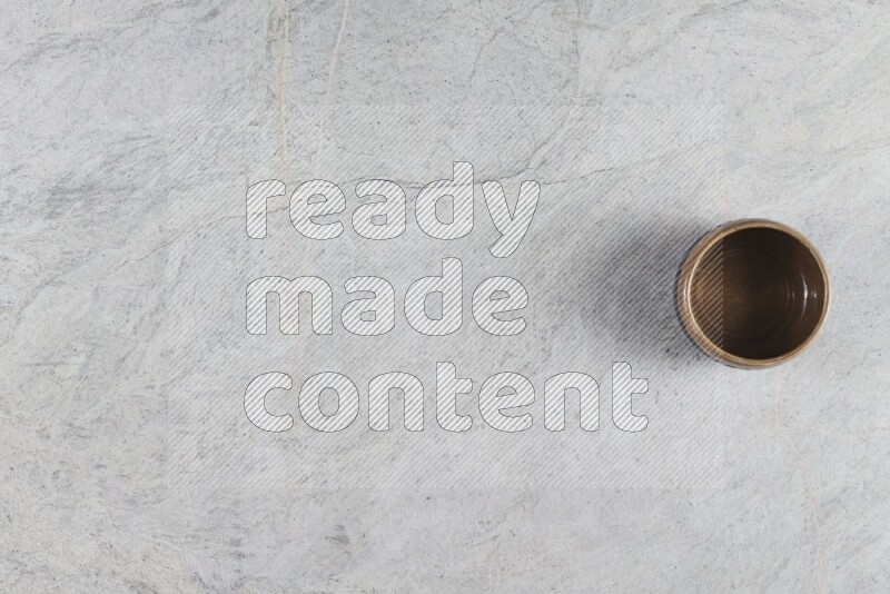 A multicolored pottery Bowl on grey marble background