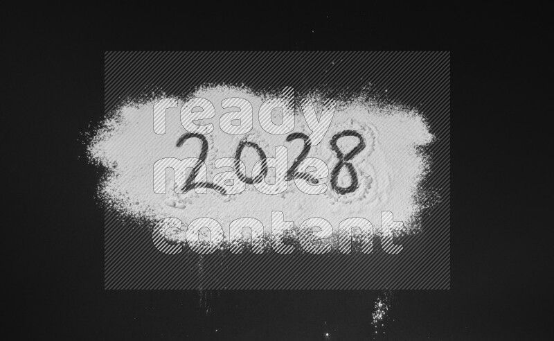 Numbers written with powder on black background