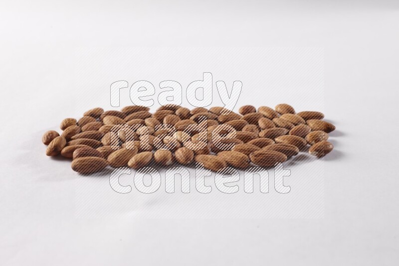 Almonds on white background