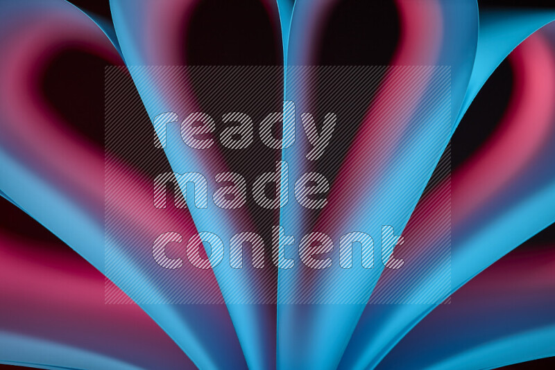 فن تجريدي يعرض منحنيات وتدرجات اللون الأزرق والأحمر مكونه بضوء ملون