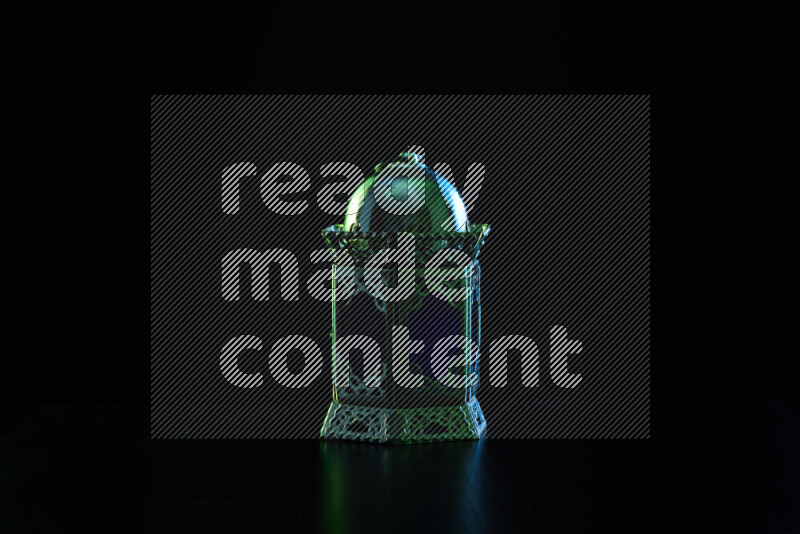 Ramadan lanterns with colored rim light against black background