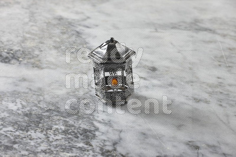 A lantern on grey marble background