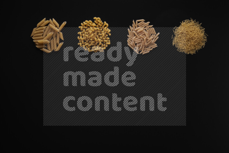 Different pasta types in 4 bunches on black background