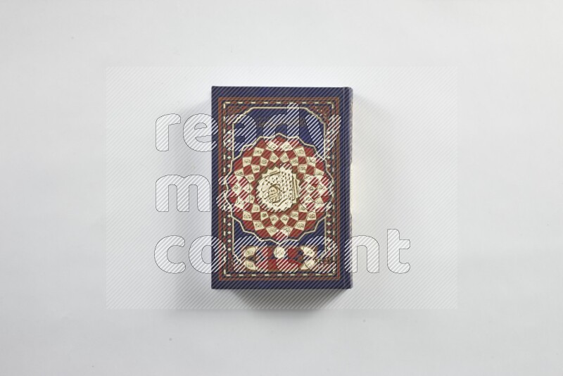 Quran with a prayer beads on white background