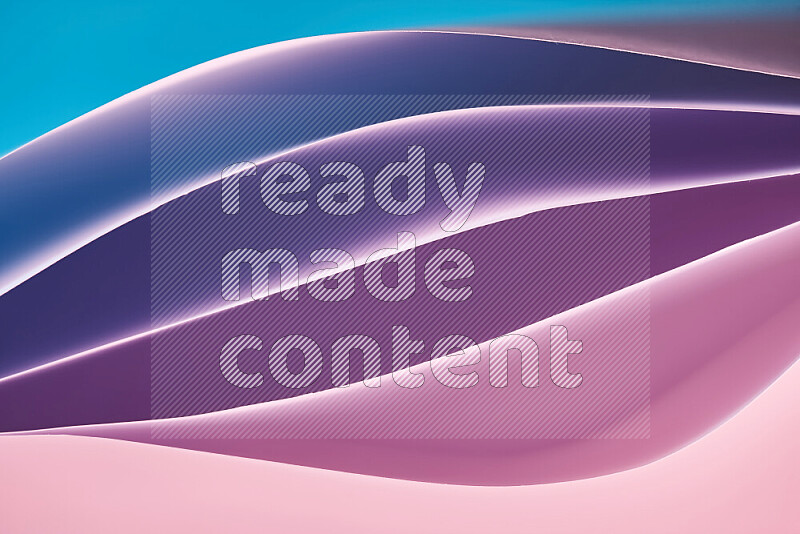 This image showcases an abstract paper art composition with paper curves in blue, purlpe and pink gradients created by colored light