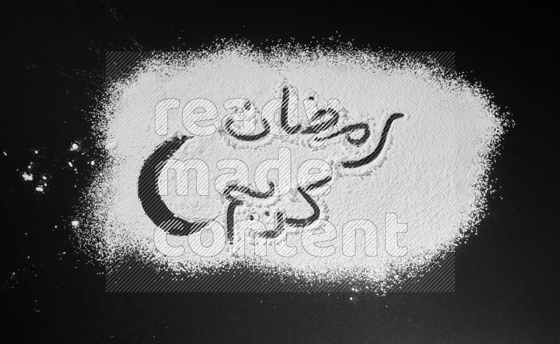 A sentence written with powder on black background