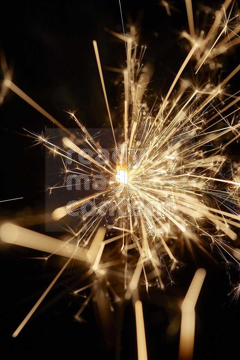 A close-up image of sparkler candle isolated on black background