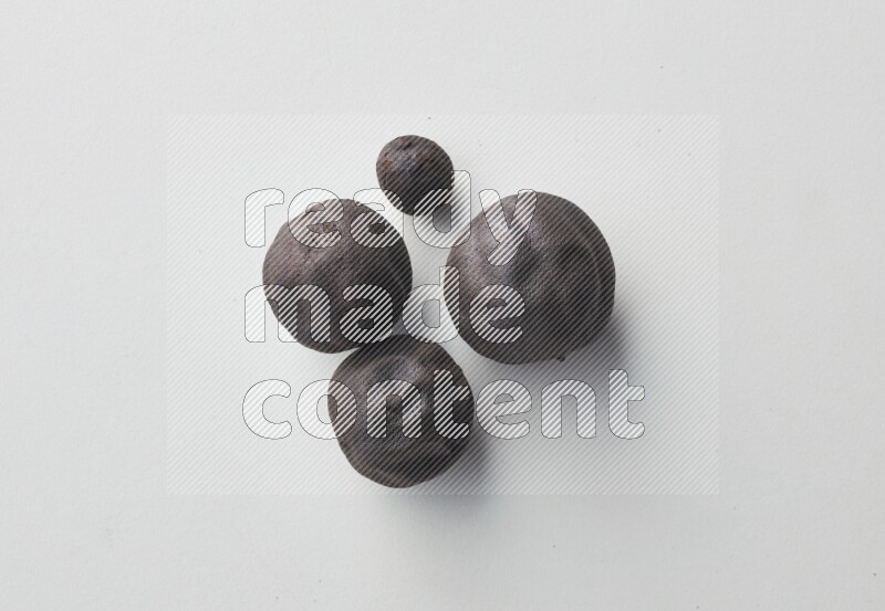 Top-view shot of dried lime (loomi) on white background