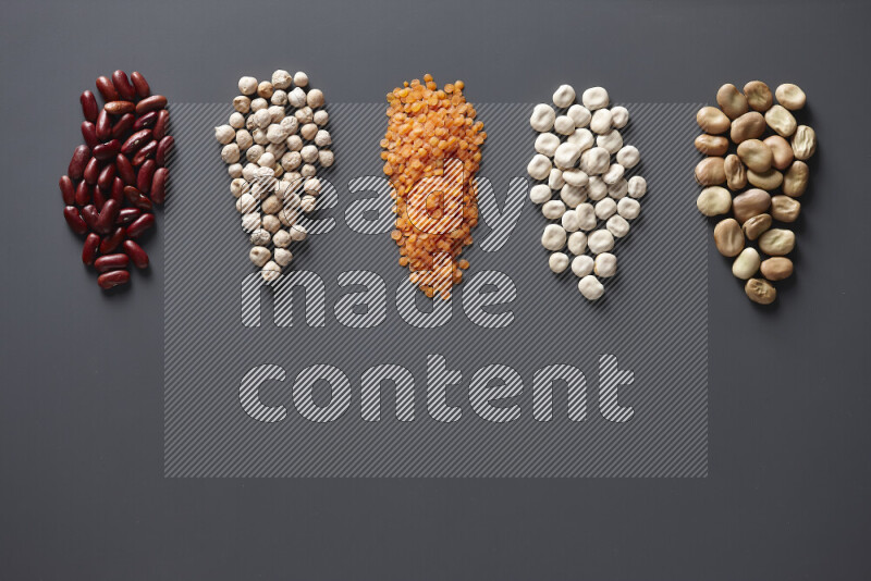 Bunches of legumes on grey background