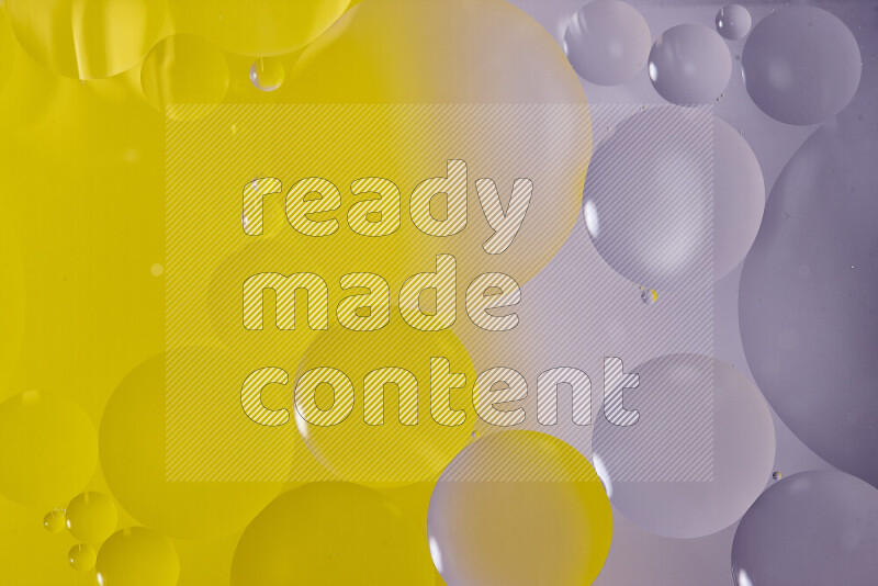 لقطات مقربة لفقاعات من الزيت على سطح الماء باللون الأبيض والأصفر