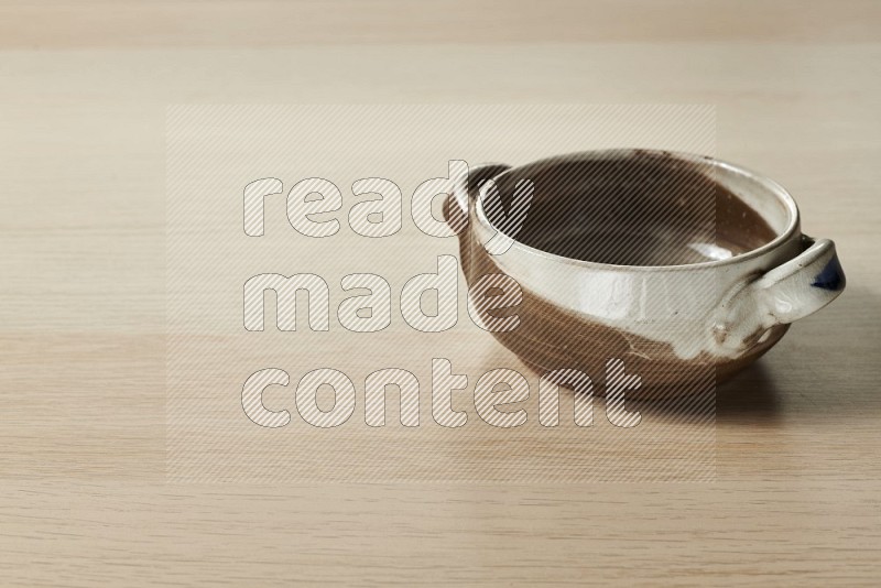 Multicolored Pottery Bowl on Oak Wooden Flooring, 15 degrees