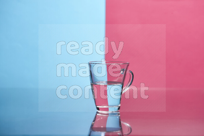 The image features a clear glassware filled with water, set against light blue and pink background