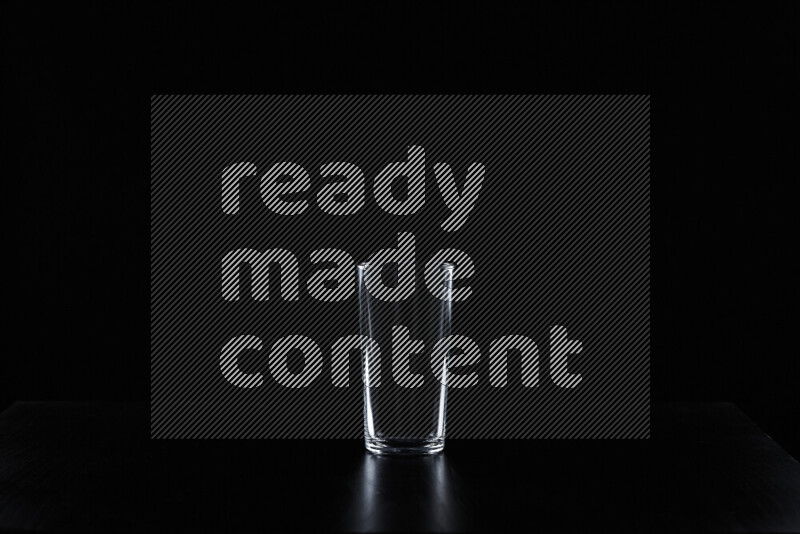 Glassware with rim light against black background