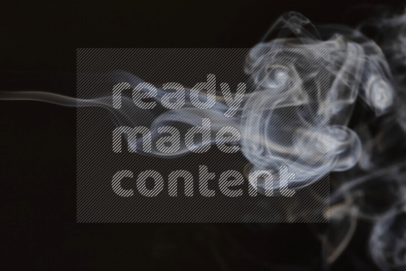 Motion of wavy smoke isolated on dark background