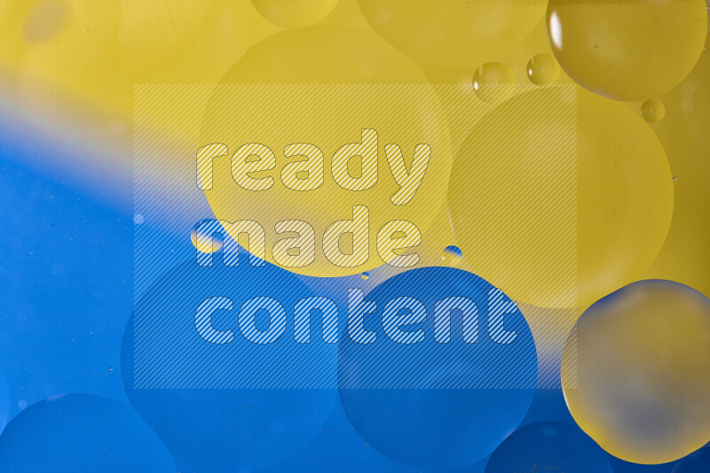 Close-ups of abstract oil bubbles on water surface in shades of blue and yellow