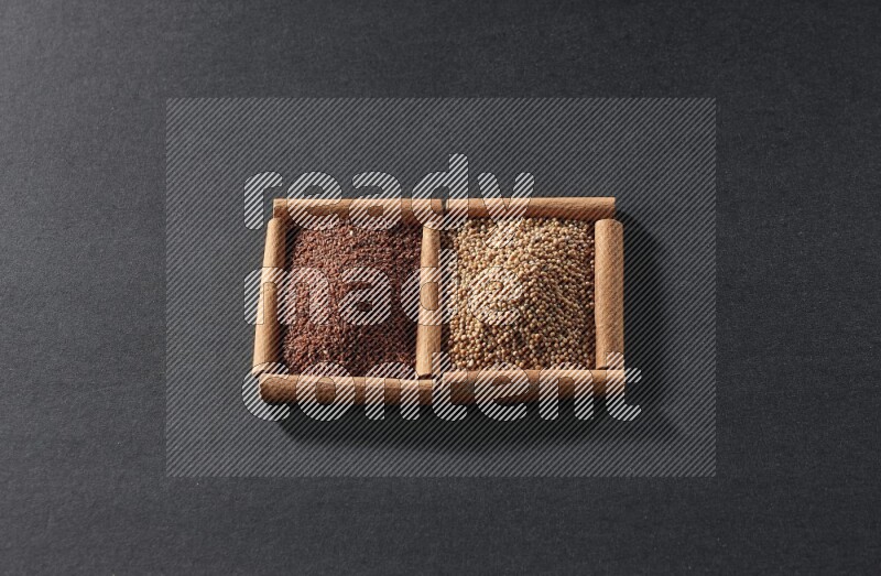 2 squares of cinnamon sticks full of mustard seeds and garden cress on black flooring