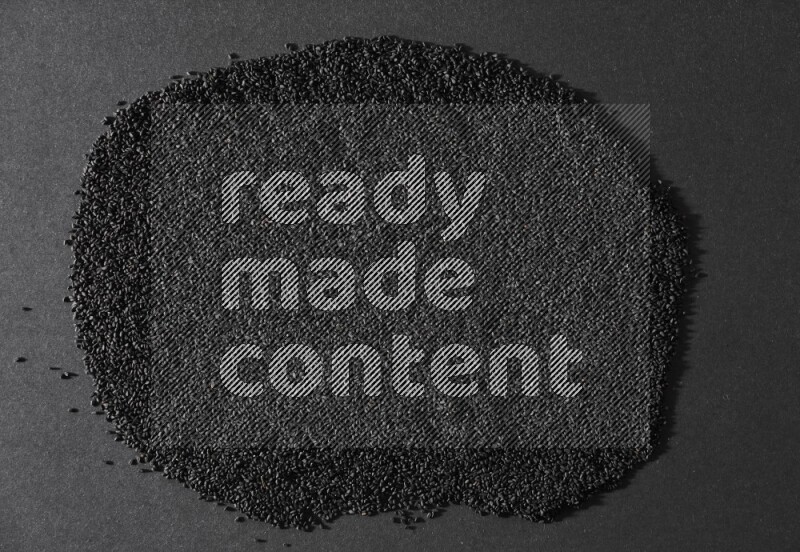 بذور حبة البركة علي الخلفية كاملة علي خلفية سوداء