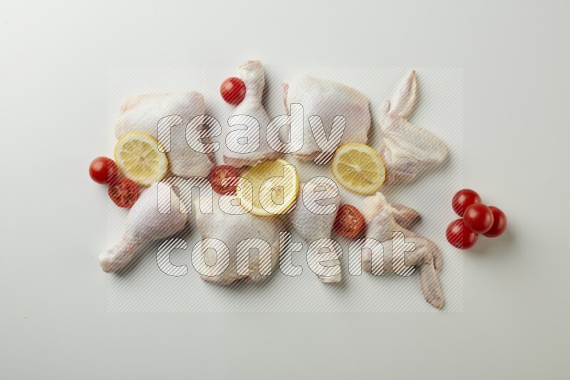 Mixed fresh chicken pieces direct on a white background
