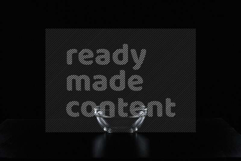 Glassware with rim light against black background