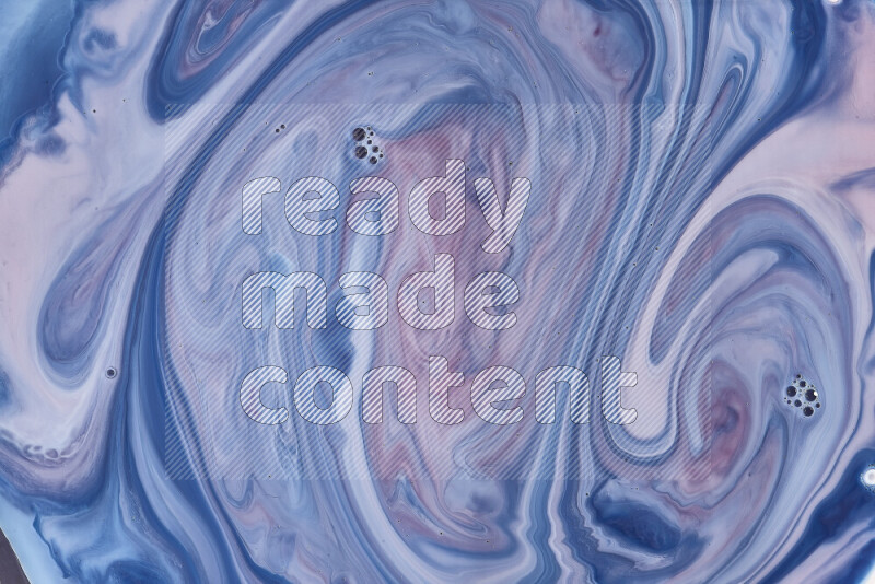 A close-up of abstract swirling patterns in blue, red and white