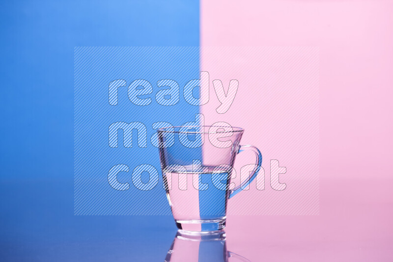 The image features a clear glassware filled with water, set against blue and rose background