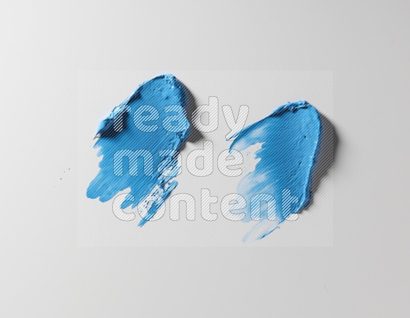 Blue painting knife strokes on white background