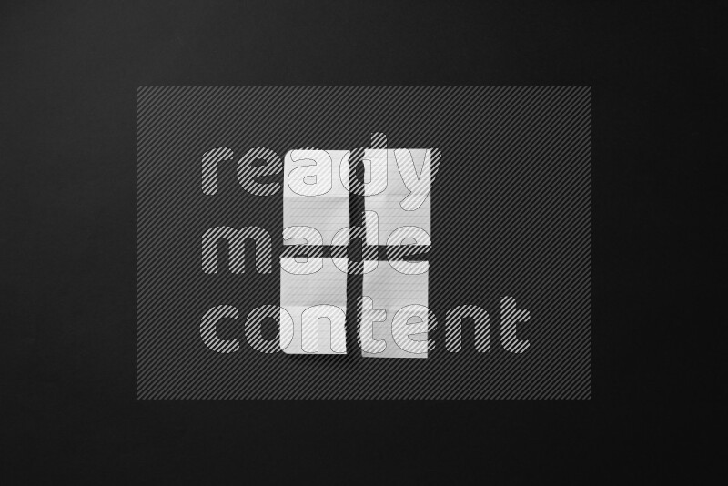 Ripped notebook sheet on black background