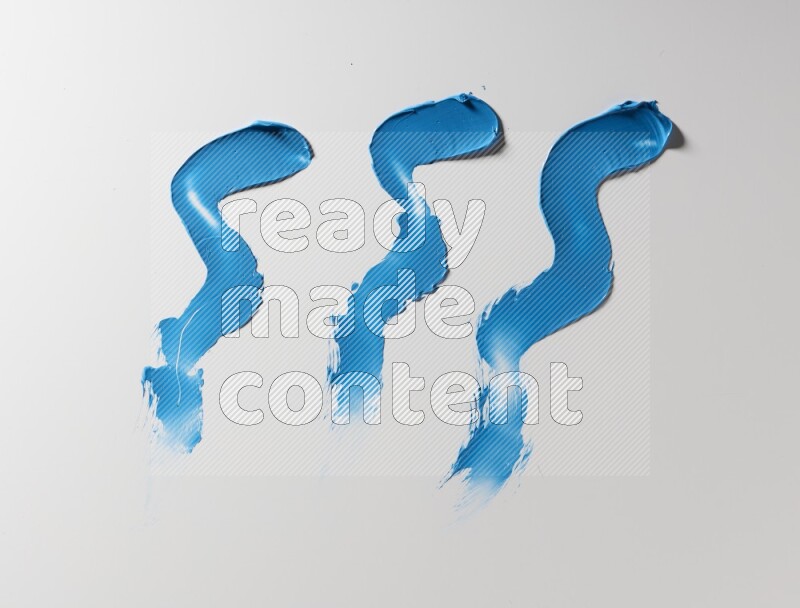 Blue zigzag painting knife strokes on white background