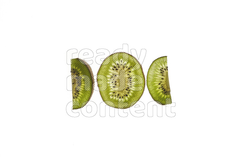 Kiwi slices on illuminated white background