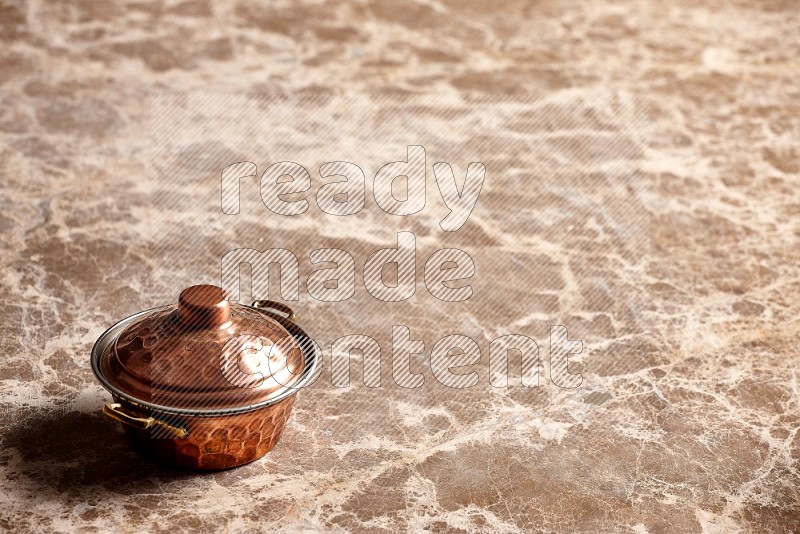 Small Copper Pot on Beige Marble Flooring, 45 degrees