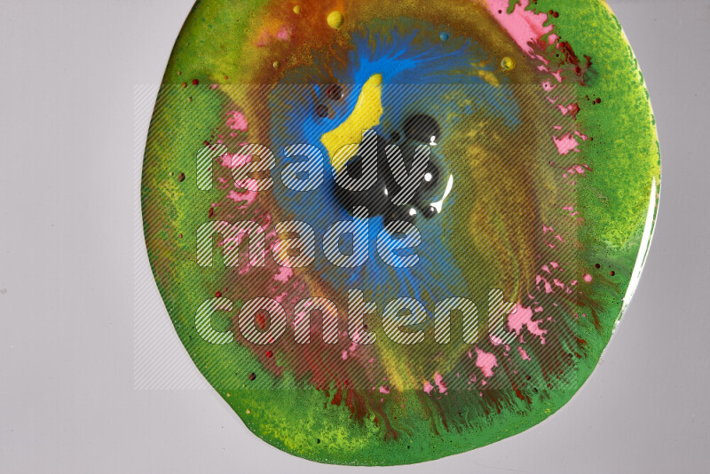 Close-ups of assorted colors blending on a grey background