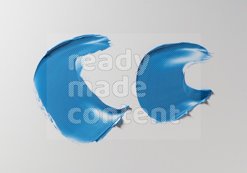 Blue curved painting knife strokes on white background