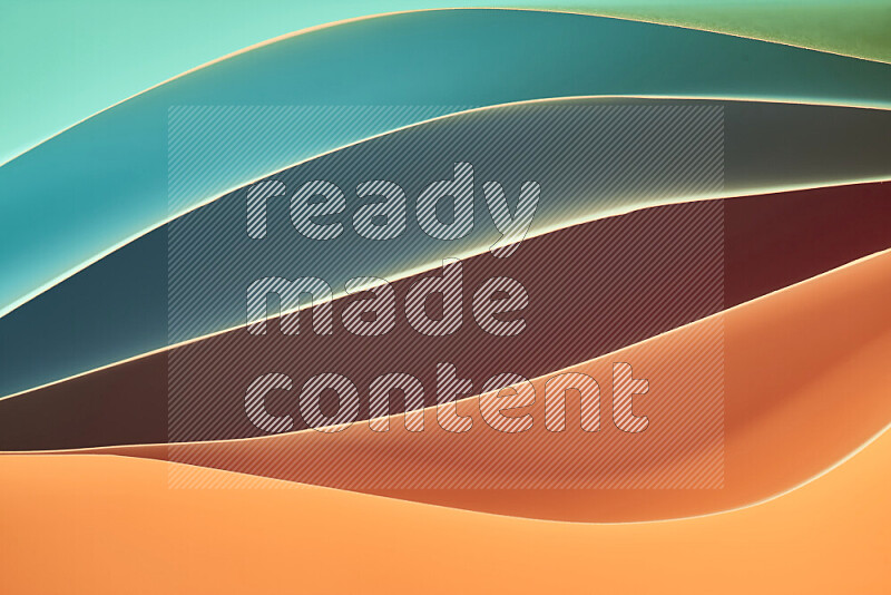 This image showcases an abstract paper art composition with paper curves in green and orange gradients created by colored light