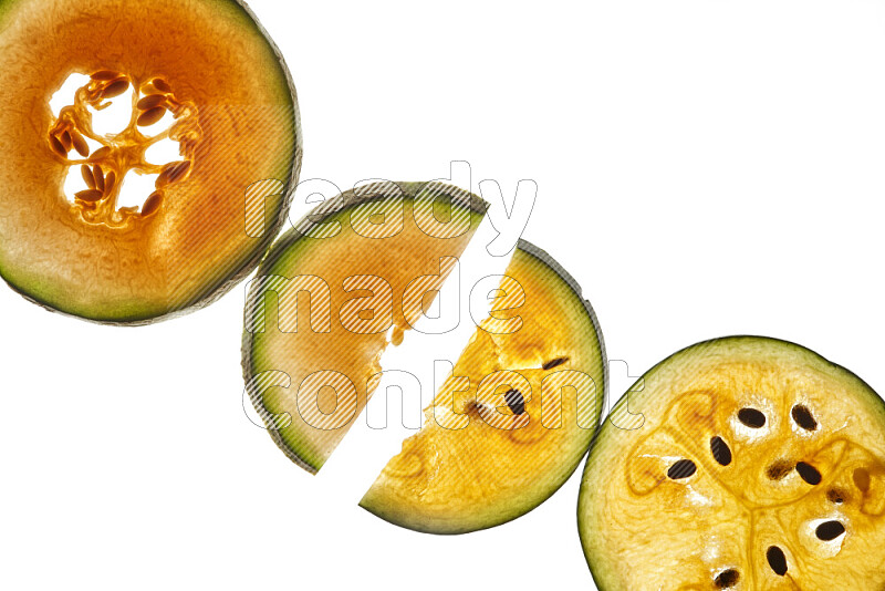 Mixed fruits slices on illuminated white background