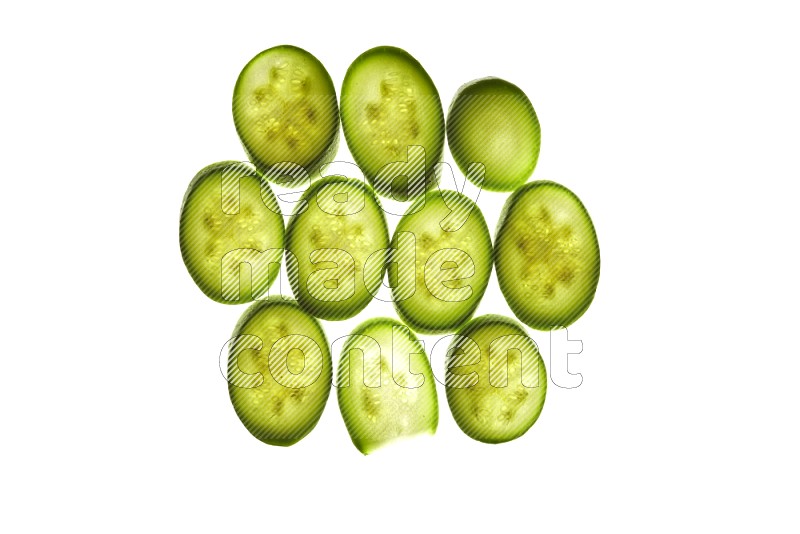 Zucchini slices on illuminated white background