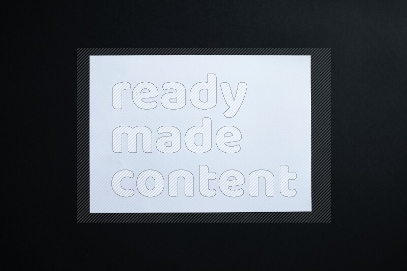 White paper sheet on black background