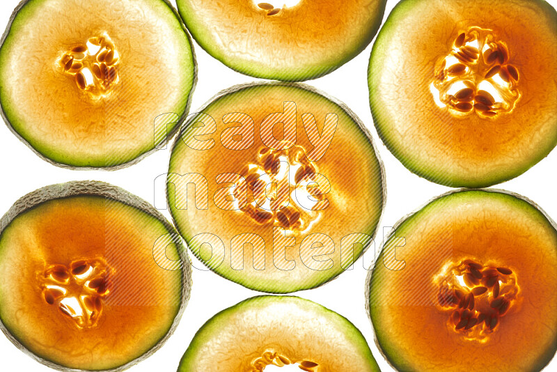 Cantaloupe slices on illuminated white background