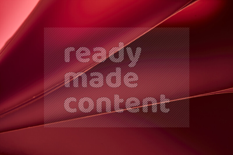 فن تجريدي يعرض منحنيات مع تدرجات الألوان الدافئة والباردة مكونه بضوء ملون