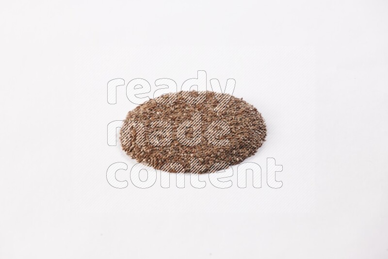 Flax seeds in a circle shape on a white flooring