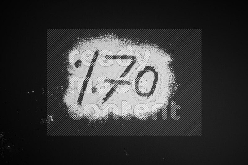 Percentages written with powder on black background