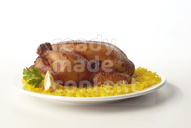 yellow  basmati Rice with  whole roasted chicken on a white rounded plate direct on white background