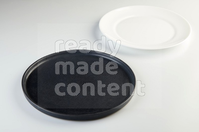 white and black plates on white background